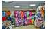 Изображение фотогаллереи №45 для раздела Разноцветные стеллажи с тонированными полками для продажи детской одежды серии KIDS-ДО
