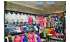 Изображение фотогаллереи №37 для раздела Разноцветные стеллажи со стеклянными полками для продажи детской одежды серии KIDS-ДО