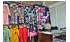 Изображение фотогаллереи №110 для раздела Разноцветные стеллажи с наклонными полками для продажи детской одежды серии KIDS-ДО