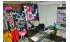 Изображение фотогаллереи №109 для раздела Разноцветные стеллажи с тонированными полками для продажи детской одежды серии KIDS-ДО