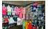 Изображение фотогаллереи №55 для раздела Разноцветные стеллажи с тонированными полками для продажи детской одежды серии KIDS-ДО