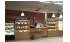 Изображение фотогаллереи №42 для раздела Хромированные стеллажи со стеклянными полками для магазина хлеба и выпечки