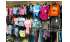 Изображение фотогаллереи №120 для раздела Разноцветные стеллажи с наклонными полками для продажи детской одежды серии KIDS-ДО